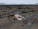High angle view of a desert community with a wide expanse of land and scattered homes at 3080 S Prairie Ave, Pahrump, NV 89048