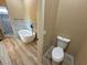 Well-designed bathroom with a soaking tub and separate toilet, showcasing modern fixtures at 3080 S Prairie Ave, Pahrump, NV 89048