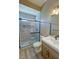 Beautiful bathroom boasts a glass shower, stylish tile work, and sleek vanity at 3080 S Prairie Ave, Pahrump, NV 89048