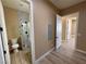 Modern bathroom featuring a glass-enclosed shower with tiled walls and wood look flooring at 3080 S Prairie Ave, Pahrump, NV 89048