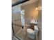 Bright bathroom features a sleek glass shower and modern vanity with white countertop at 3080 S Prairie Ave, Pahrump, NV 89048
