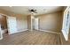 Bright bedroom with wood-look floors and ensuite bathroom at 3080 S Prairie Ave, Pahrump, NV 89048