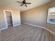 Expansive bedroom featuring wood-look floors and great closet access at 3080 S Prairie Ave, Pahrump, NV 89048