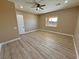 Spacious bedroom with wood-look floors and ample natural light at 3080 S Prairie Ave, Pahrump, NV 89048