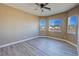 Bright bedroom with scenic views from its plentiful windows and wood-look flooring at 3080 S Prairie Ave, Pahrump, NV 89048