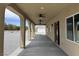 Inviting covered patio with ceiling fans for comfortable outdoor living and relaxation at 3080 S Prairie Ave, Pahrump, NV 89048