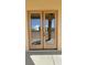 Elegant double entry doors welcome you into this home, reflecting outdoor light at 3080 S Prairie Ave, Pahrump, NV 89048