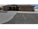 Charming front exterior of a home showcasing a manicured yard and inviting entrance at 3080 S Prairie Ave, Pahrump, NV 89048