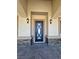 Close-up of the stylish front door with decorative glass and stone accents at 3080 S Prairie Ave, Pahrump, NV 89048