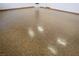 Epoxy garage flooring is shown in this image, with white walls in the background at 3080 S Prairie Ave, Pahrump, NV 89048