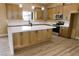 Open kitchen with large island, stainless steel appliances, and modern cabinetry at 3080 S Prairie Ave, Pahrump, NV 89048