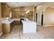 Spacious kitchen featuring ample counter space, stainless steel appliances and view to the dining area at 3080 S Prairie Ave, Pahrump, NV 89048