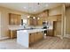 Well-lit kitchen featuring stainless steel appliances, modern lighting, and spacious layout at 3080 S Prairie Ave, Pahrump, NV 89048