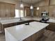 Modern kitchen with stainless steel appliances, ample counter space and island with seating at 3080 S Prairie Ave, Pahrump, NV 89048