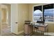 Cozy office space with a desk and a view, featuring a view and natural light at 3080 S Prairie Ave, Pahrump, NV 89048