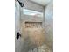 Elegant tiled shower with a built-in niche and a modern showerhead at 3080 S Prairie Ave, Pahrump, NV 89048