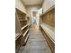 Large walk-in closet with built-in shelving, rods, and a view into the bathroom at 3080 S Prairie Ave, Pahrump, NV 89048