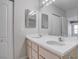 Well-lit bathroom featuring double sinks and large mirror at 3604 Lisandro St # 204, Las Vegas, NV 89108