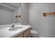 Clean bathroom with a single sink vanity, toilet, and tiled shower at 3604 Lisandro St # 204, Las Vegas, NV 89108
