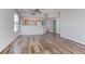 Bright, open-concept living room featuring wood-look flooring and natural light, complemented by neutral walls at 3604 Lisandro St # 204, Las Vegas, NV 89108