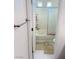 Bathroom featuring a white bathtub and shower combination with a sliding glass door at 3634 Surfboard Ct, Las Vegas, NV 89147