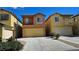 Charming two-story home featuring a private balcony, attached garage and well-maintained front yard at 3634 Surfboard Ct, Las Vegas, NV 89147