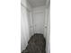 Hallway featuring multiple doors and neutral carpet, offering privacy and transition between rooms at 3634 Surfboard Ct, Las Vegas, NV 89147