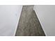 Neutral-toned hallway carpet offers a seamless transition between rooms with a clean, uncluttered aesthetic at 3634 Surfboard Ct, Las Vegas, NV 89147