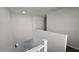 Upstairs hallway showcases railing and access to the downstairs area at 3634 Surfboard Ct, Las Vegas, NV 89147