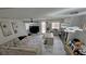 Open-concept living room with island seating connecting to kitchen area at 3634 Surfboard Ct, Las Vegas, NV 89147