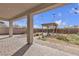 Backyard space with a covered patio, brick pavers, and a pergola at 4211 Enchanting Sky Ave, North Las Vegas, NV 89081
