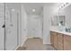 This bathroom features a walk-in shower, and vanity with sink at 4211 Enchanting Sky Ave, North Las Vegas, NV 89081