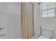 Clean bathroom with a shower-tub combination, white subway tiles, and a sleek toilet at 4211 Enchanting Sky Ave, North Las Vegas, NV 89081