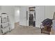 Bedroom with carpet floors, closet and open door to hallway at 4211 Enchanting Sky Ave, North Las Vegas, NV 89081
