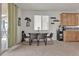 Bright dining area features a modern table set and sliding glass doors for seamless indoor-outdoor living at 4211 Enchanting Sky Ave, North Las Vegas, NV 89081
