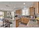 Bright kitchen featuring granite countertops, stainless steel appliances, and an open layout to the dining area at 4211 Enchanting Sky Ave, North Las Vegas, NV 89081