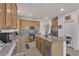Well-equipped kitchen featuring granite countertops, a center island, stainless steel appliances, and plenty of cabinet space at 4211 Enchanting Sky Ave, North Las Vegas, NV 89081
