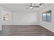Spacious living room with hardwood flooring and natural light coming through multiple windows at 4244 Golden Sol St, North Las Vegas, NV 89032