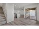 Open living area with stairs and sliding glass doors that let in natural light at 4244 Golden Sol St, North Las Vegas, NV 89032