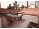 Spacious backyard featuring patio area, perfect for outdoor dining and entertaining with barbecue and outdoor furniture at 5032 Dancing Lights Ave, Las Vegas, NV 89130