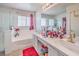 Bright bathroom with a tub, shower, and double sinks at 5032 Dancing Lights Ave, Las Vegas, NV 89130