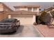 Charming two-story home featuring a two-car garage, desert landscaping, and a well-maintained front yard at 5032 Dancing Lights Ave, Las Vegas, NV 89130
