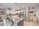 Stylish kitchen featuring granite counters, stainless steel appliances, and pendant lighting over a breakfast bar at 5032 Dancing Lights Ave, Las Vegas, NV 89130