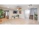 Spacious living room with neutral tile flooring, recessed lighting, and an inviting open layout with staircase at 5032 Dancing Lights Ave, Las Vegas, NV 89130