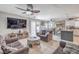 Open living space with seamless flow to dining and kitchen, tiled floors, and modern lighting at 5032 Dancing Lights Ave, Las Vegas, NV 89130