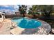 A full eye-level view of the in-ground pool in a landscaped backyard at 5279 Consul Ave, Las Vegas, NV 89142