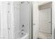 Clean bathroom featuring a white tub and shower combination with a bright white tile surround and a shower curtain at 5615 Distelrath Ave, Las Vegas, NV 89122