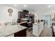 Modern kitchen with granite countertops, stainless steel appliances, and a central island at 5615 Distelrath Ave, Las Vegas, NV 89122