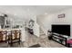 Open-concept living space with hardwood floors, ample natural light, and staircase to the second floor at 5615 Distelrath Ave, Las Vegas, NV 89122