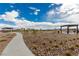 Park area with walkway, decorative stone and desert landscaping at 5615 Distelrath Ave, Las Vegas, NV 89122